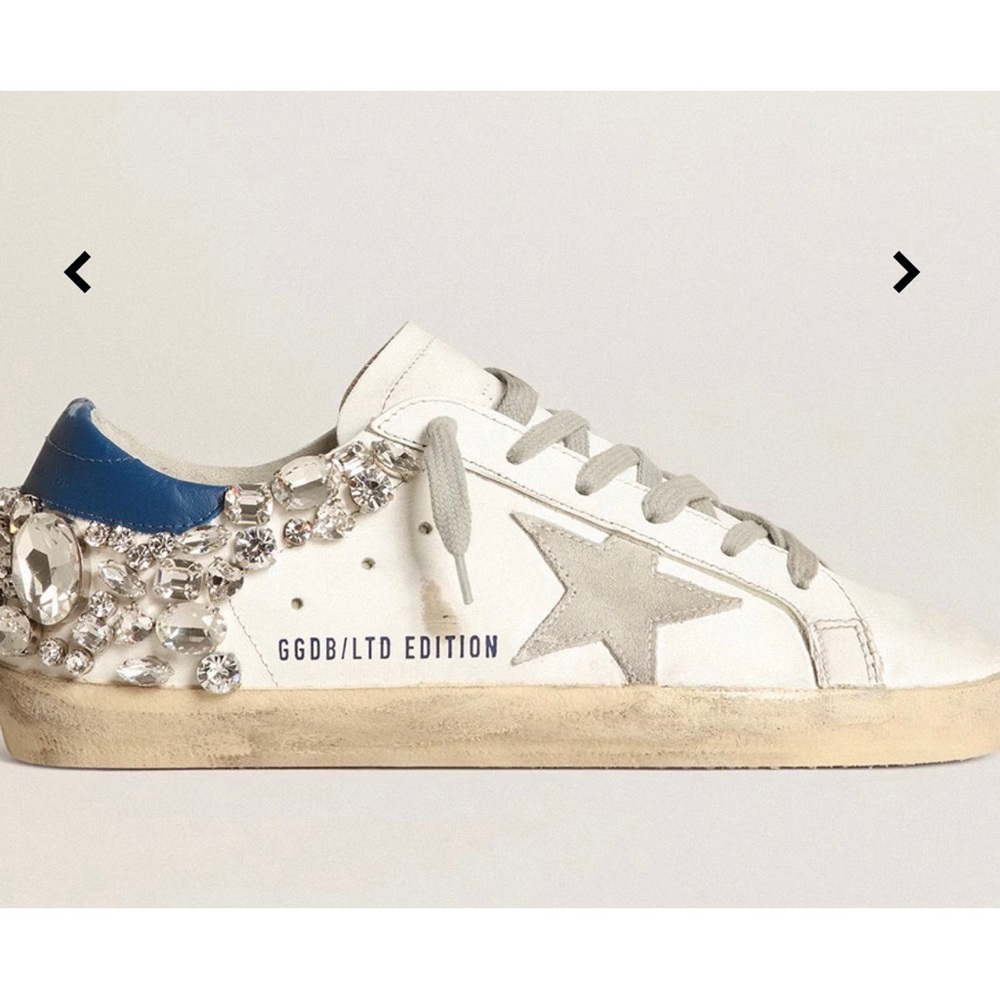 Super-Star with a white leather upper feature a star in ice-gray suede